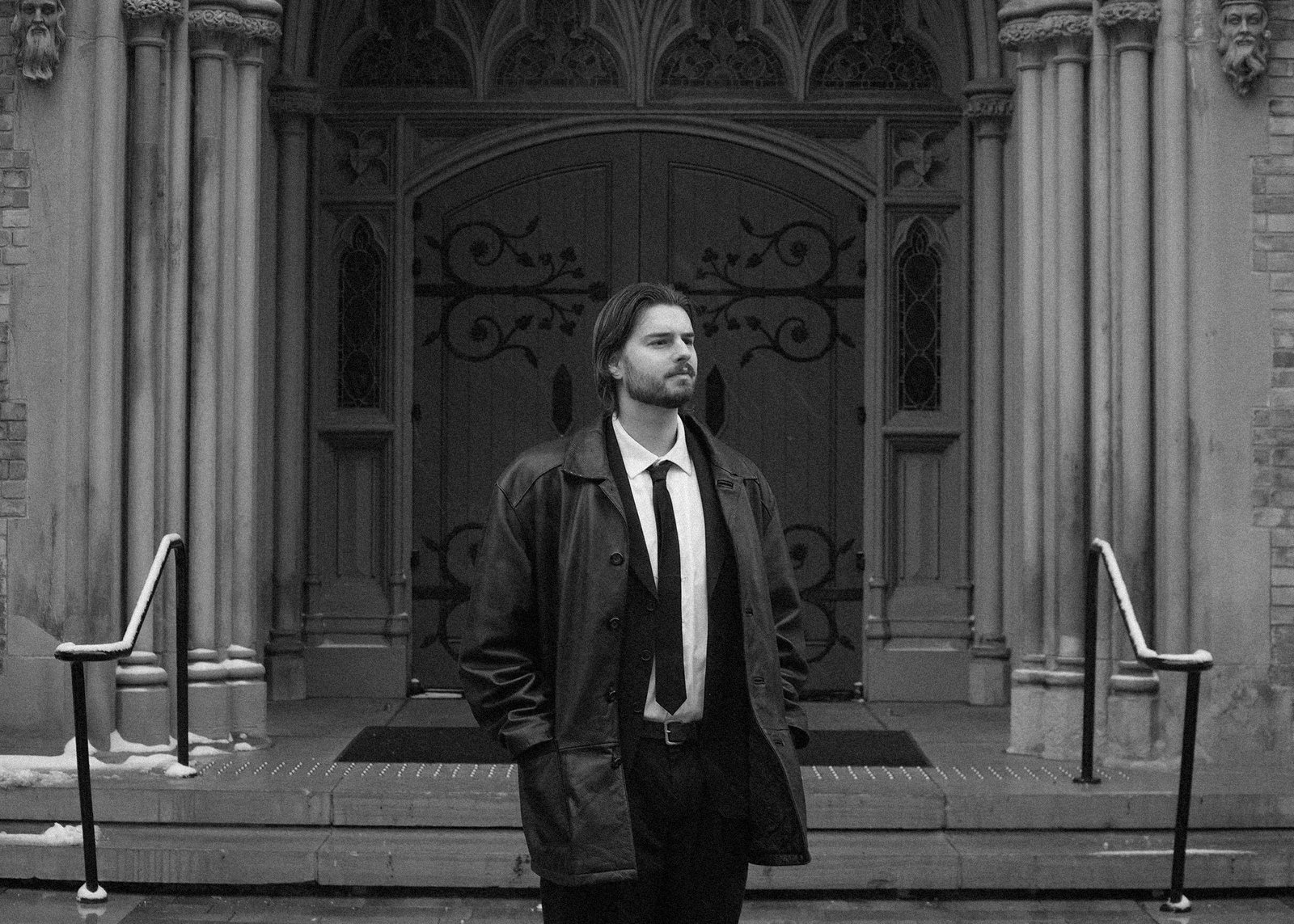 Quinn Mills at the carved doors of the church
