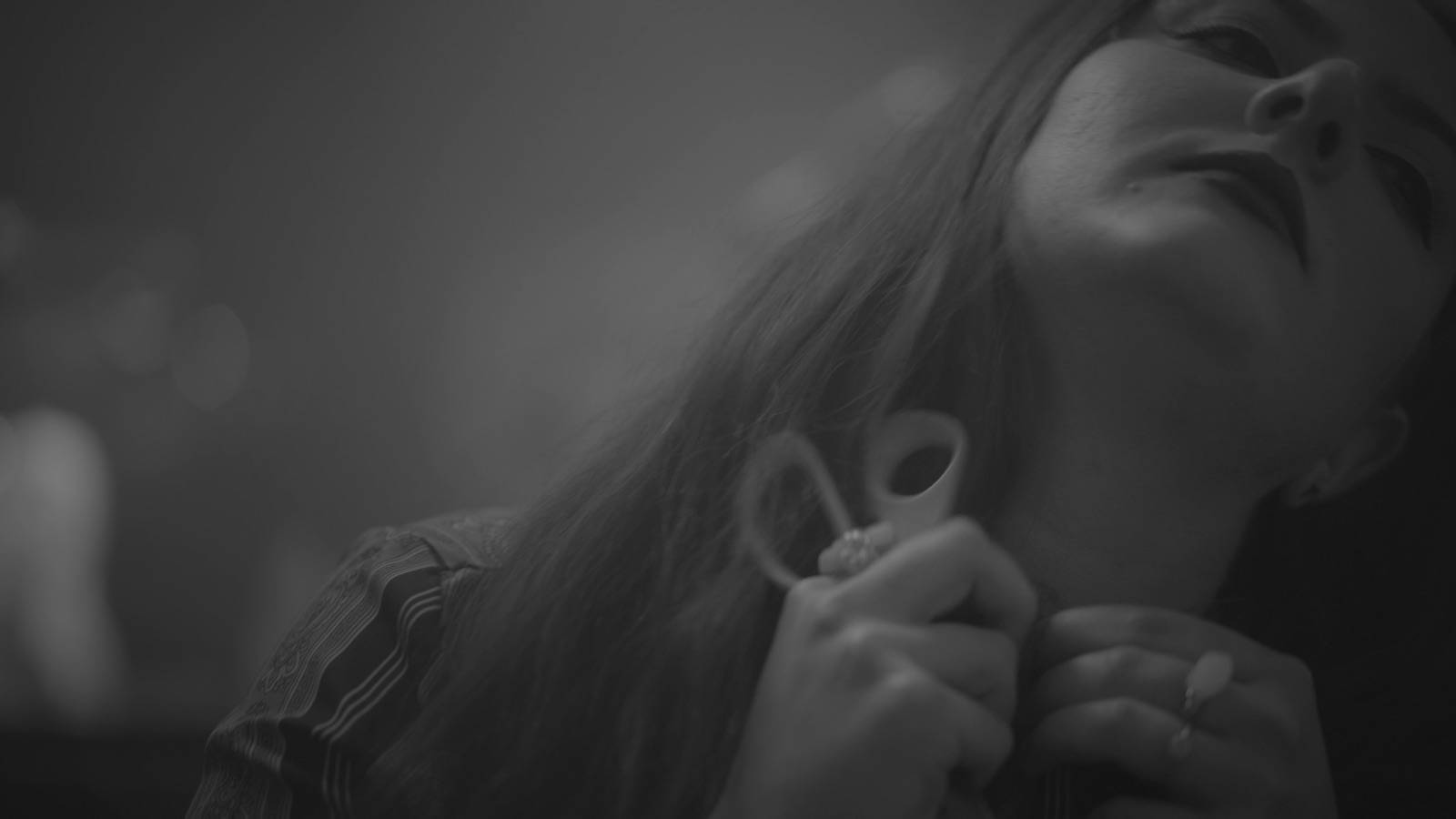 Low-lit cinematic still from the Flashlife video