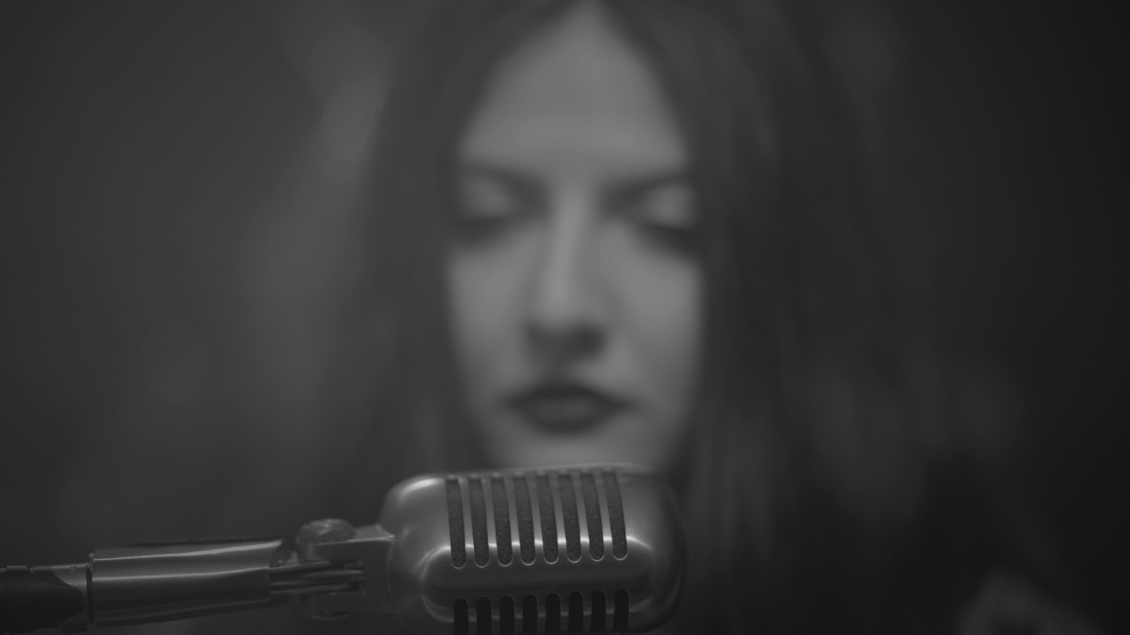 Moody black-and-white still from the Flashlife video